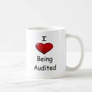 i love being audited mug